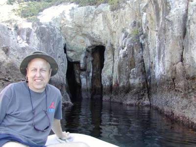 Wolfgang checks out a cave by dinghy