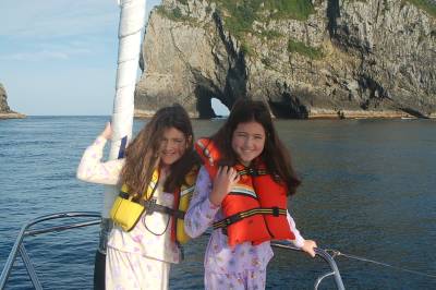 Kenzie and Marissa with the Hole in the Rock at Cape Brett
