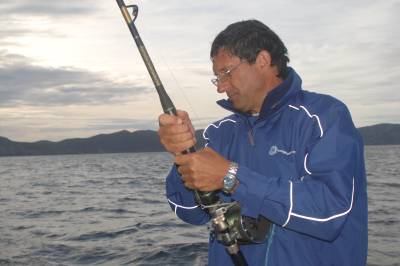 Kim brings in a tuna as weather detreiorates