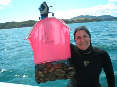 Betty with a bag of scallops and clams and a bloody nose
