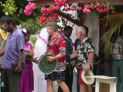 Bradley and Ron greet the bride and groom